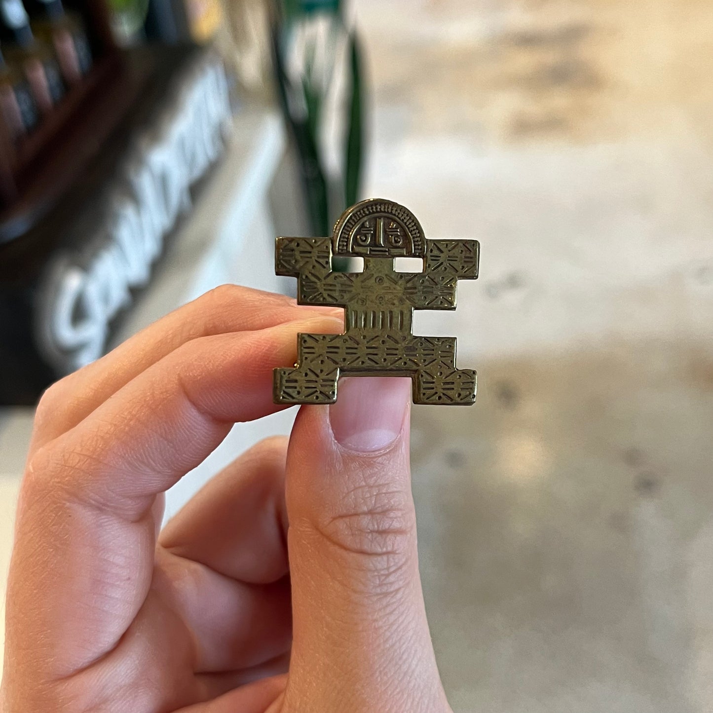 Funky brass guy Aztec style brooch